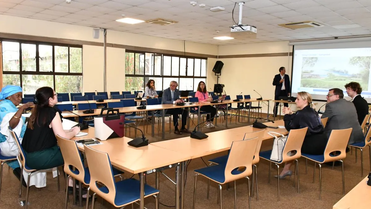 Members of the EEG attending a presentation in a conference room