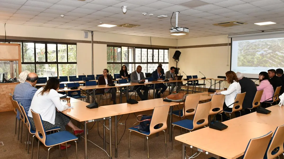 Members of the GRULAC attending a presentation in a conference room