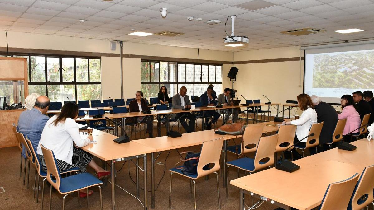 Members of the GRULAC attending a presentation in a conference room
