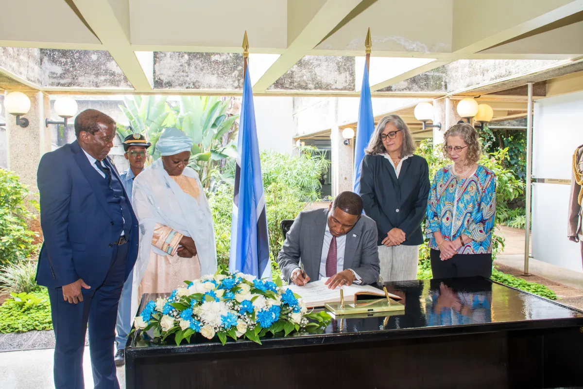 The President of the Republic of Botswana signing the Visitors Welcome book