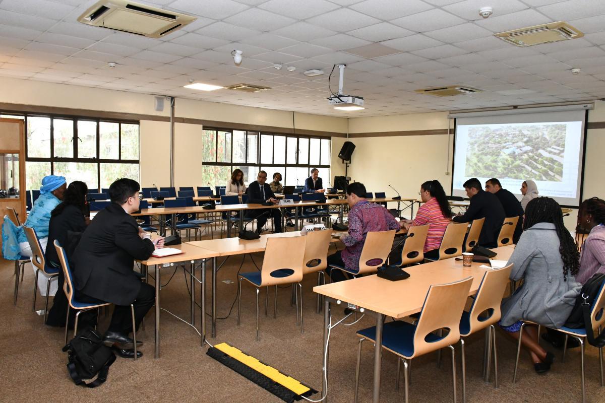 Members of the APG attending a presentation in a conference room