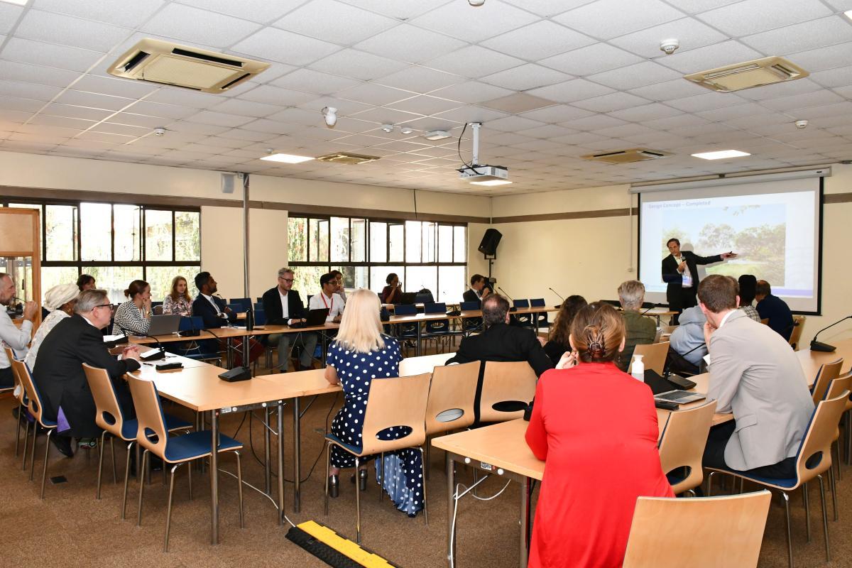 Members of the WEOG attending a presentation in a conference room